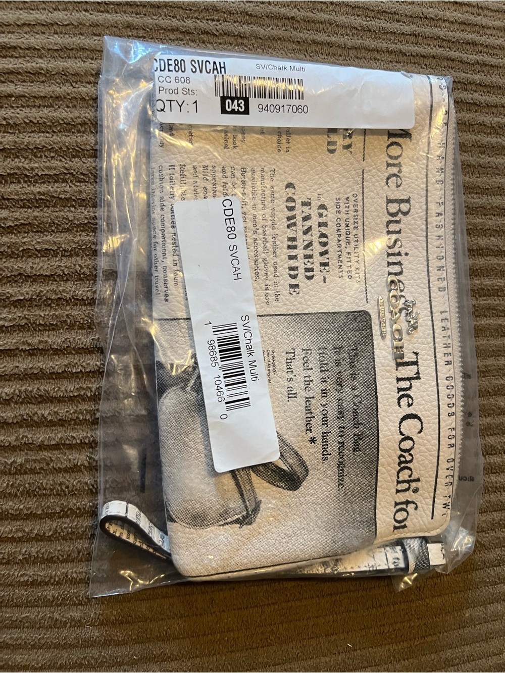 Coach Large Corner Zip Wristlet
With Newspaper Print NWT (the print will vary)